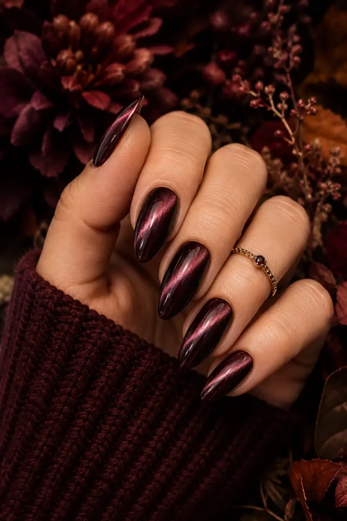 20. Deep Berry Almond Nails with Cat Eye Magnetic Polish