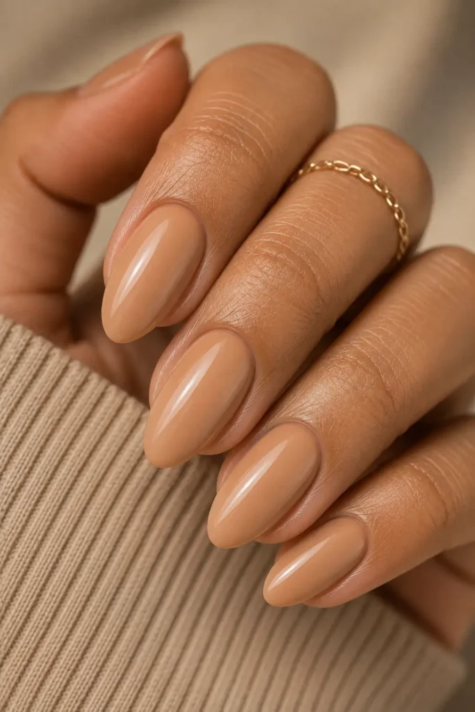 18. Warm nude on medium almond nails