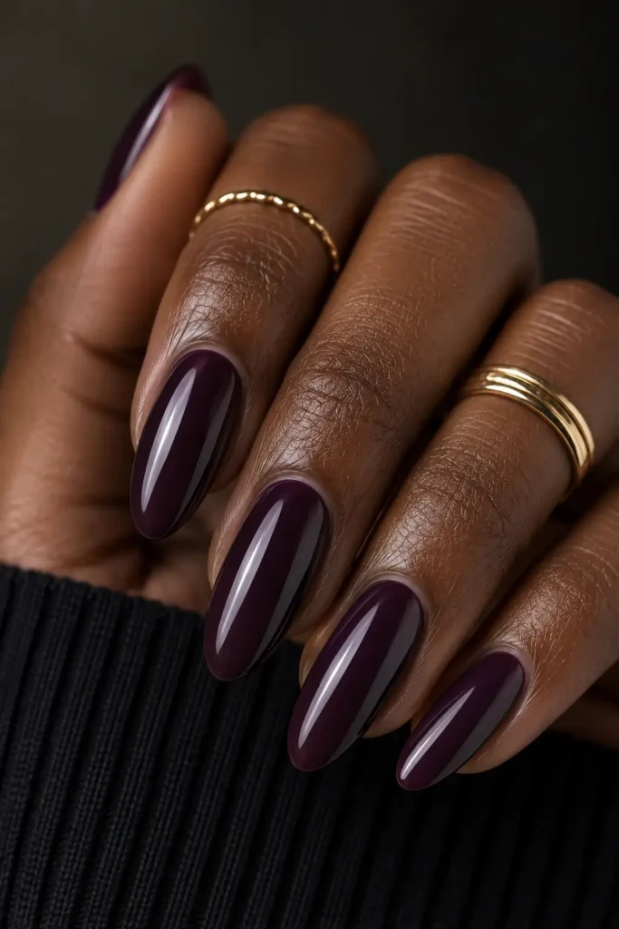 7. Deep plum on long almond nails